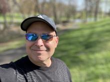 Chuck Schmidt selfie with hat and sunglasses 